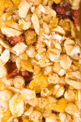 muesli bars with dried fruit on isolated background close-up