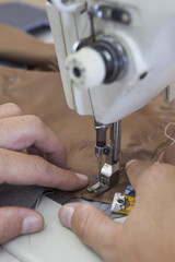 25 September 2012 at a tailor in Barcelona, Spain. Production process of suit tailoring. Sewing of...