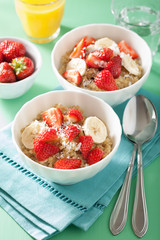 healthy breakfast quinoa with strawberry banana coconut flakes