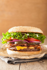bacon cheese burger with pickles tomato onion