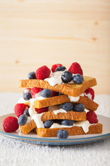 french toasts with creme fraiche and berries for breakfast