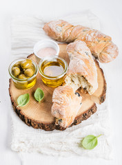 Fresh ciabatta bread, Mediterranean olives and fresh vrgine oil with basil 