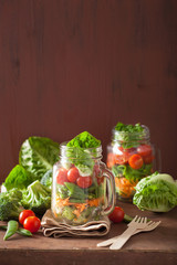 healthy vegetable salad in mason jar. tomato, broccoli, carrot,