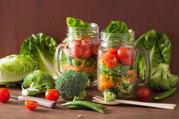 healthy vegetable salad in mason jar. tomato, broccoli, carrot,
