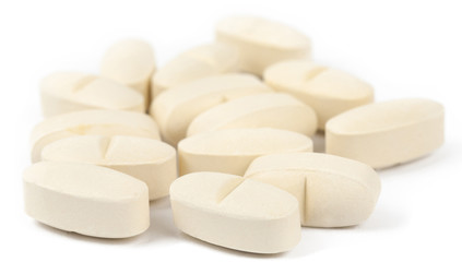 Fototapeta na wymiar vitamin pills on white surface