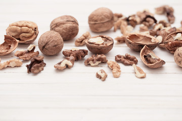 walnuts on white wooden background