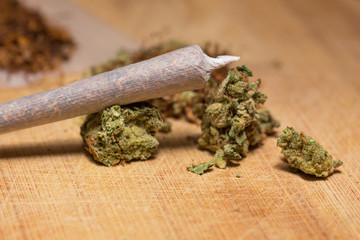 drug marijuana on a wooden background