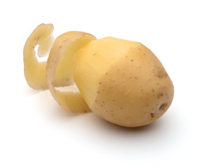 peeled potato tuber with peel spiral isolated on white backgroun