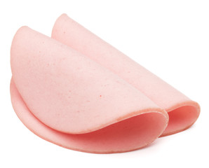cooked boiled ham sausage or rolled bologna slices isolated on w © Natika
