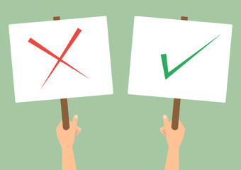 Human hands hold a check and cross protest signs on green background.