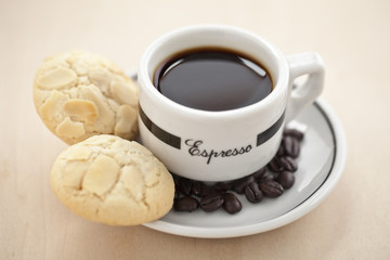 cookie on saucer with coffee drink