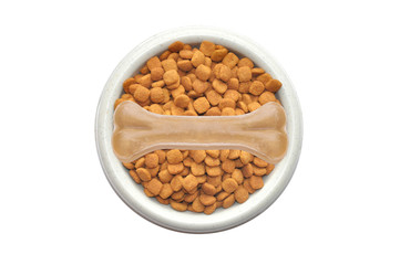 Dry dog food and bone in plate isolated on white background