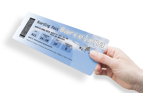 Hand of a woman holding a airplane ticket to Barcelona 