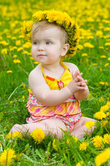 Happy little girl  on the meadow