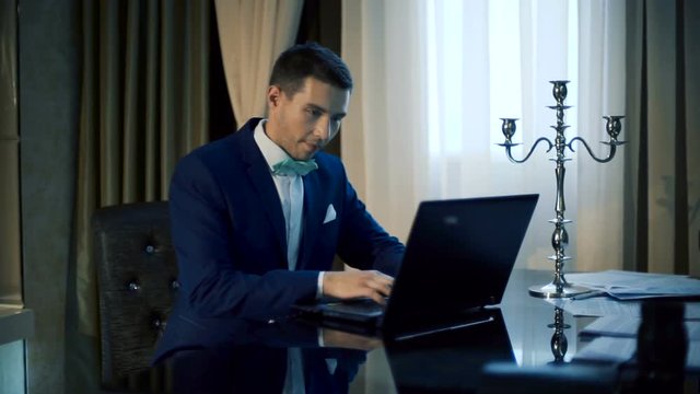 handsome man working on laptop