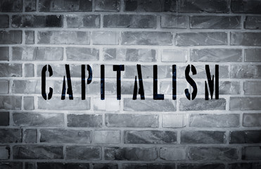 Capitalism stencil print on wall