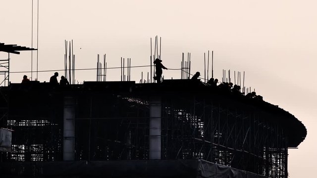 Worker set up concrete mold in construction site, Time lapse.