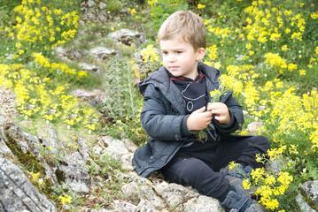 small mountain climber sits on top of the mountain