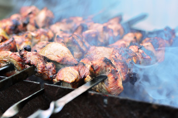 Shish kebab is prepared on skewers on the grill