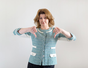 young woman showing her thumb down