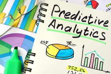 Predictive Analytics written on a notepad sheet.