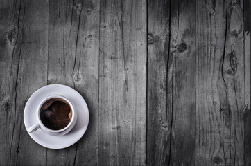 Coffee cup top view on wooden table background