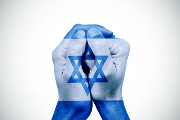 hands patterned with the flag of Israel