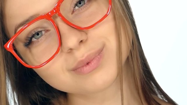 The girl in the red glasses posing on a white background,slow motion