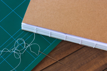 Handbound book with needle and thread
