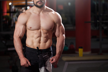 muscular bodybuilder on black background