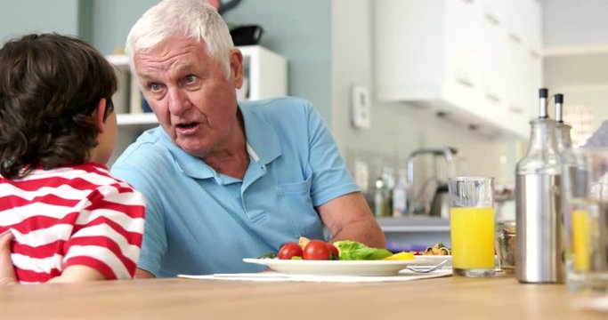 Grandfather talking with his grandson