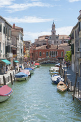 View of the streets of Venice and parked boats.
