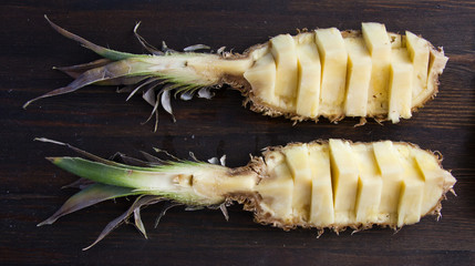 sliced pineapple on a wooden background