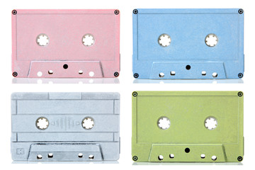 multicolored audio tapes on white isolated background