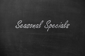Seasonal Specials text. Written in chalk on a blackboard.
