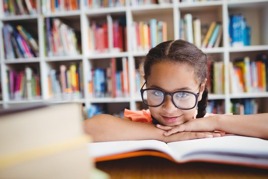 Little girl reading a book