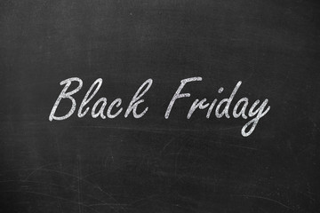 Obraz premium Black friday text, concept on school blackboard or chalkboard.