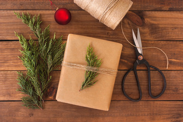 Christmas gift on rustic wooden background