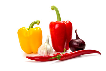 red, yellow bell pepper with chili pepper on a white background