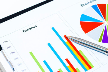 Colorful business charts with black clipboard