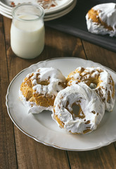 Meringue donuts served with a glass of milk