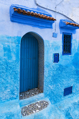 Detail of a door and window in the town of Chefchaouen, in Morocco