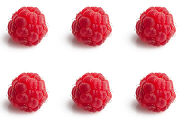 Big darkened raspberries arranged in pattern on gray background