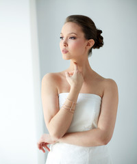 beautiful asian woman with golden bracelet