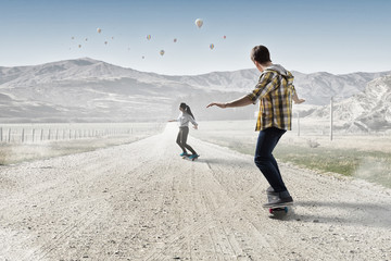 Young people riding skateboard