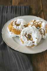 Meringue donuts on a white plate