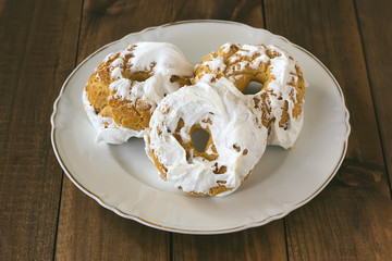 Meringue donuts on a white plate