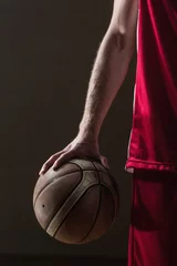 Foto auf Alu-Dibond Close up on basketball held by basketball player © WavebreakMediaMicro