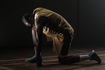 Basketball player preparing to play with knee 