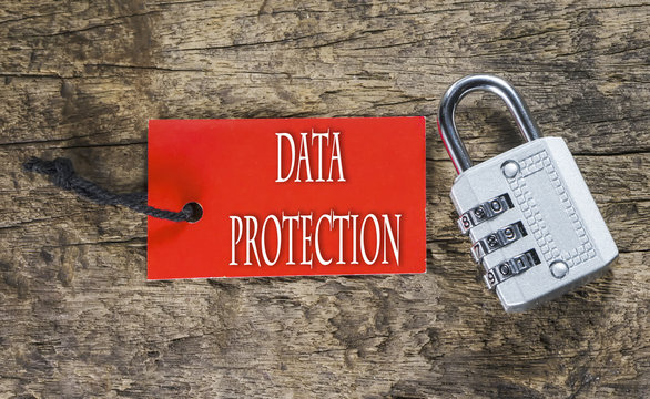 Combination number padlock on wood background with Data Protecti